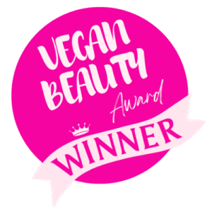 Badge showing winner of the Vegan Beauty Award, lipstick, eye pencil, mascara