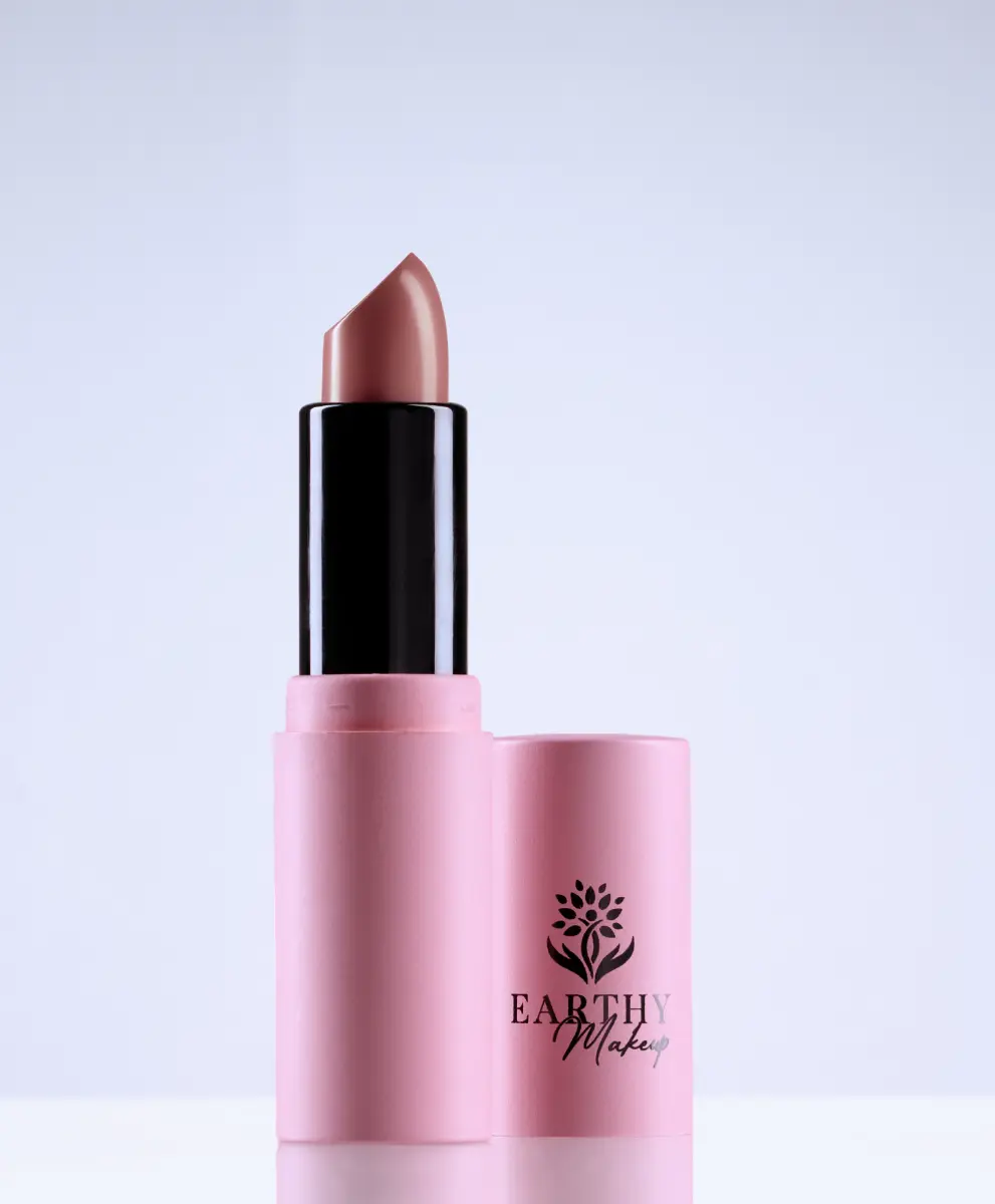 A single red lipstick uncapped, the dreamy coral color