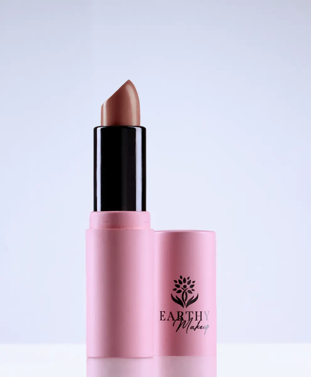 A single red lipstick uncapped, the dusty rose color