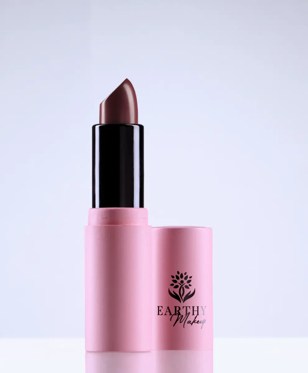 A single red lipstick uncapped, the terra color